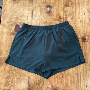 Girlfriend Collective Gazelle running shorts in moss green